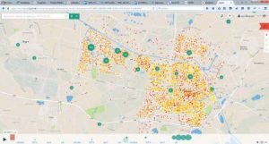 Figure: Combined visualization of different data sources in LizardTM : water consumption in yellow-orange-red (from low to high) and clustered client reports of noise nuisance (green circles with number of reports in the middle). 